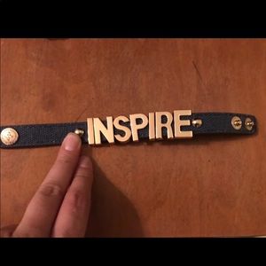 Inspire in gold bracelet. Clasp closure.